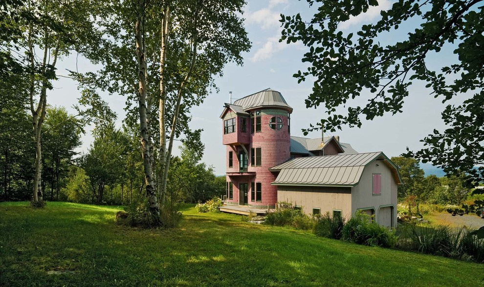 Eclectic house exterior in Burlington with three floors.