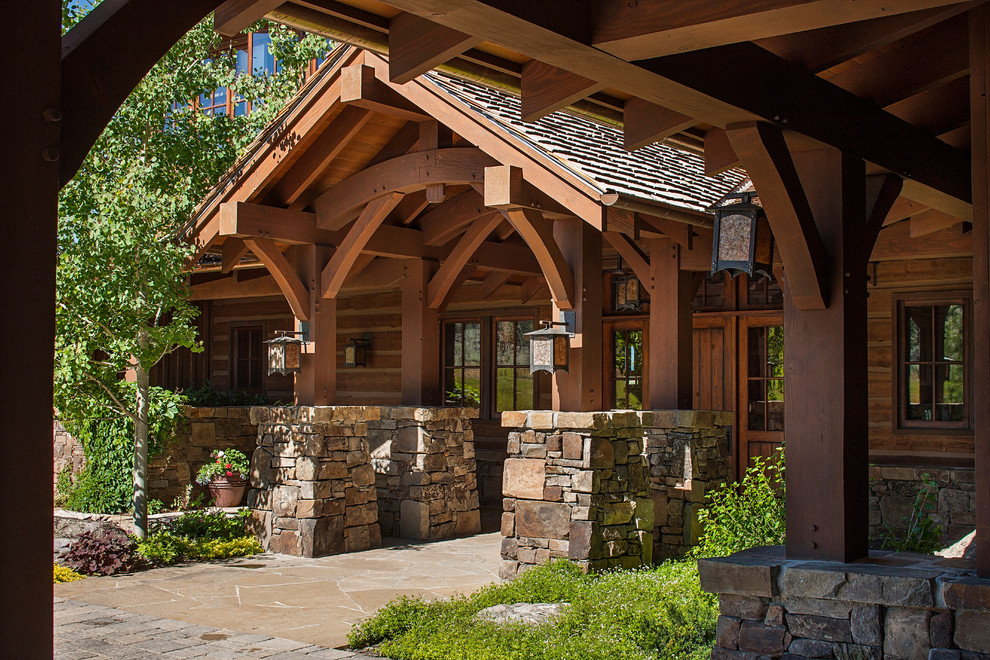 Large mountain style brown two-story wood gable roof photo in Kansas City
