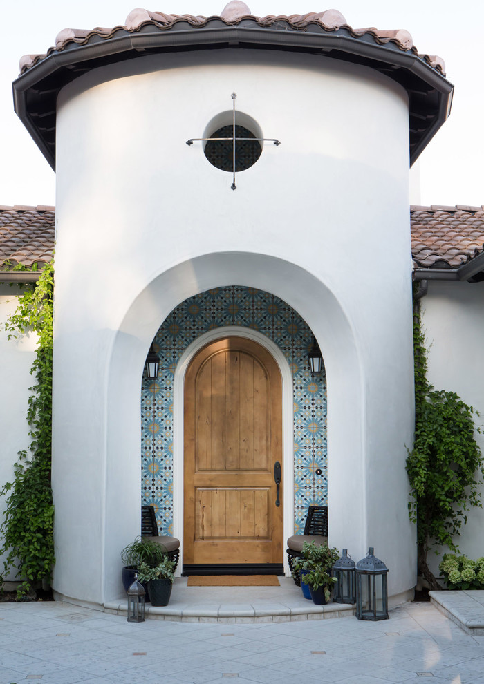 Inspiration for a large and white mediterranean bungalow render house exterior in San Diego.