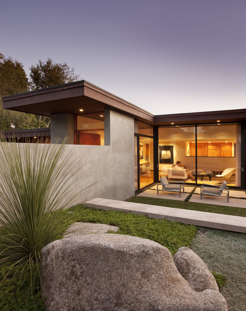 Example of a minimalist one-story glass exterior home design in Santa Barbara