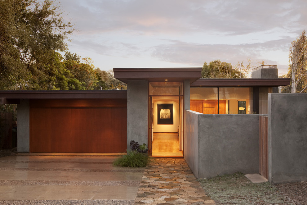 This is an example of a modern bungalow glass house exterior in Santa Barbara.