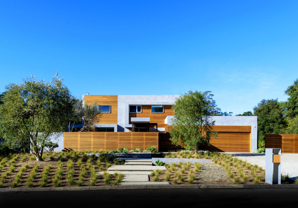 Example of a trendy brown two-story wood exterior home design in Santa Barbara