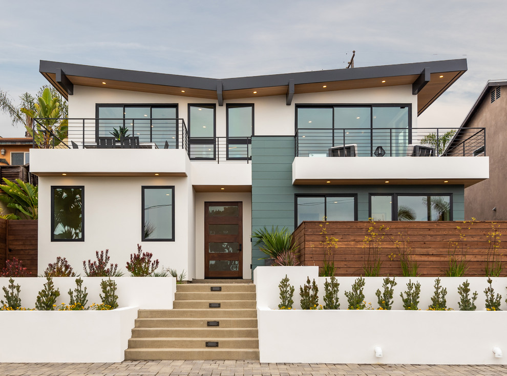 Design ideas for a large and white contemporary two floor detached house in San Diego with mixed cladding, a mixed material roof and a lean-to roof.
