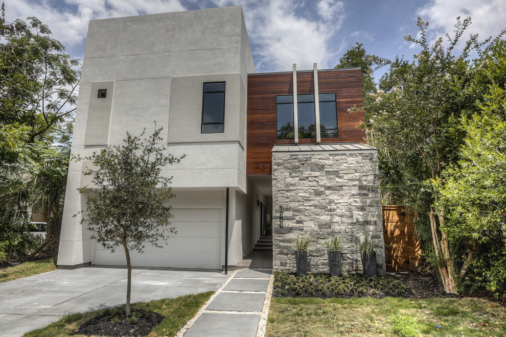 ヒューストンにある高級なコンテンポラリースタイルのおしゃれな家の外観 (混合材サイディング、緑化屋根) の写真
