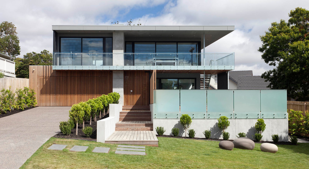 Large and multi-coloured contemporary two floor detached house in Melbourne with a flat roof.