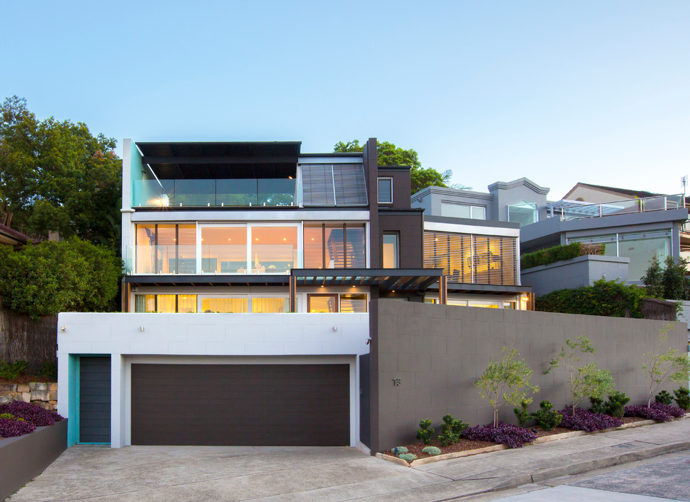 This is an example of a large contemporary house exterior in Sydney with three floors.