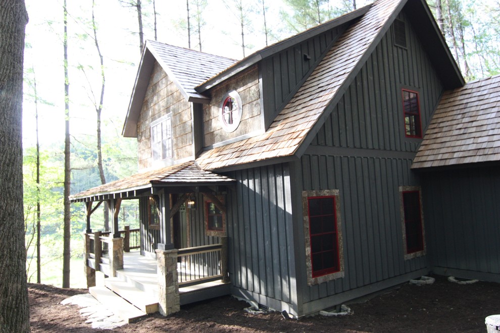 Photo of a gey rustic two floor house exterior in Charlotte with mixed cladding.