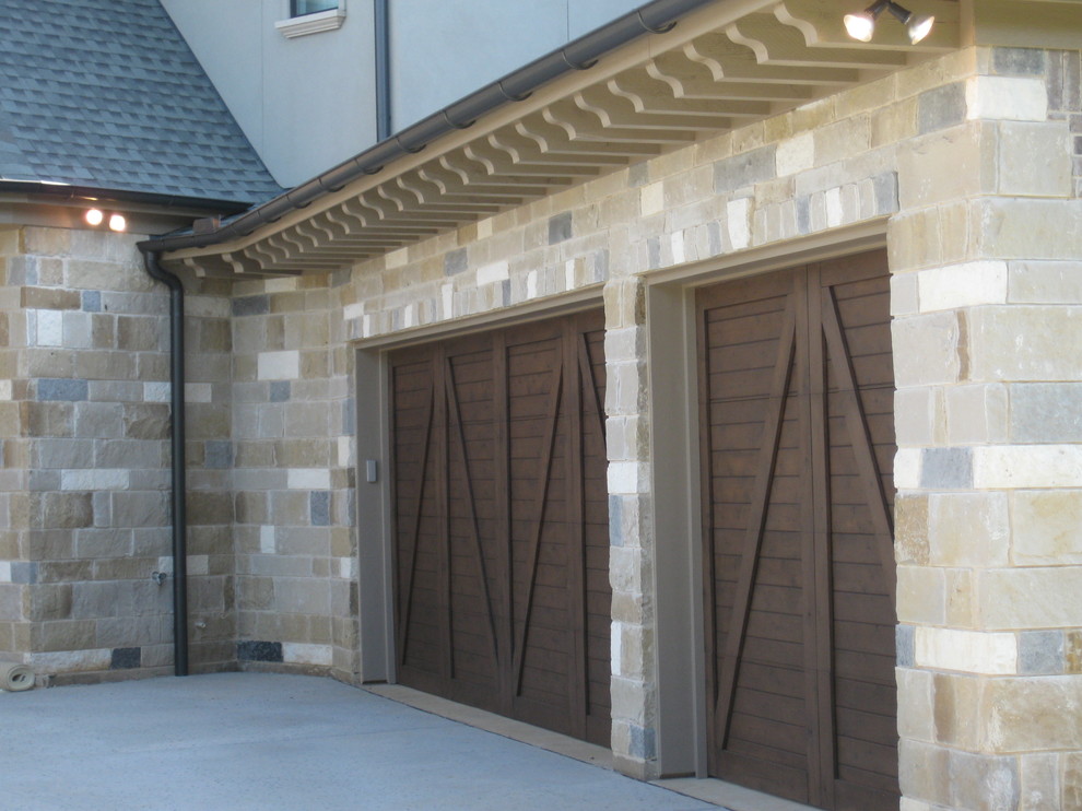 Photo of a large and beige traditional two floor brick house exterior in Dallas with a pitched roof.