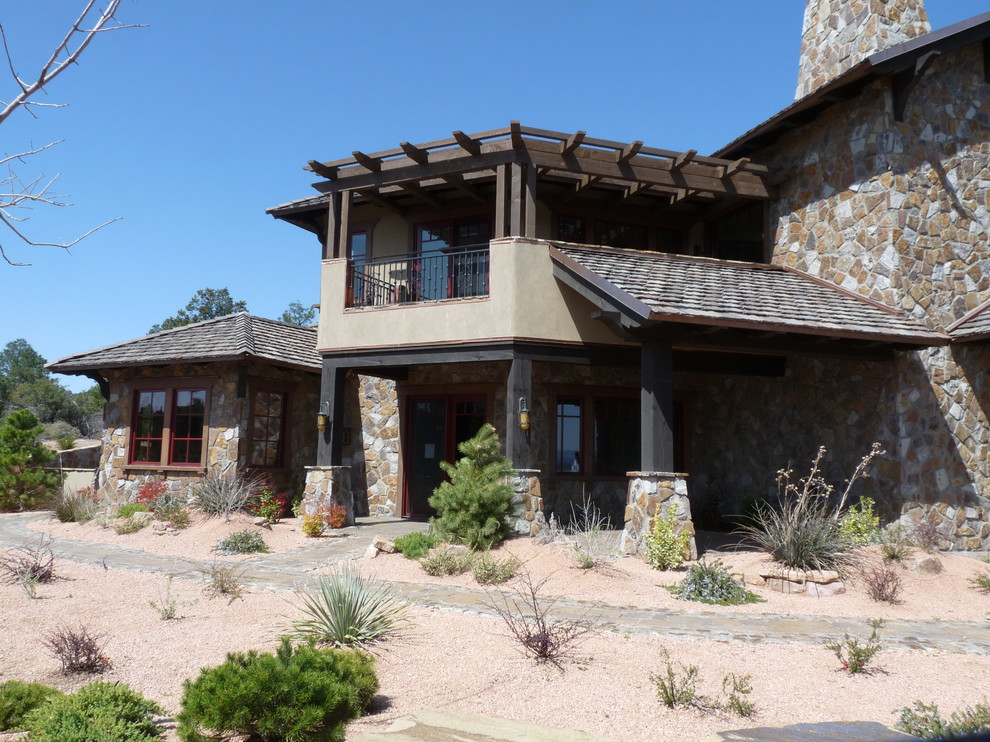 Huge mountain style brown two-story mixed siding gable roof photo in Phoenix