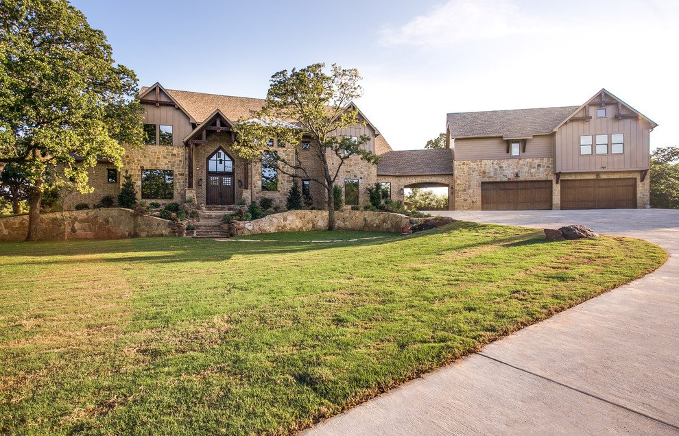 Expansive and brown classic two floor house exterior in Dallas with mixed cladding and a hip roof.