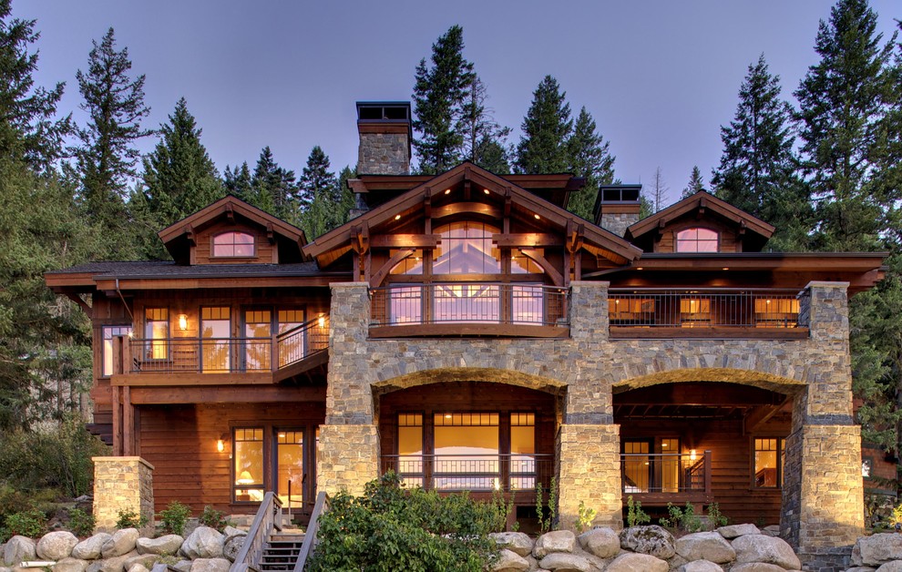Example of a mid-sized mountain style brown two-story mixed siding exterior home design in Seattle with a shingle roof