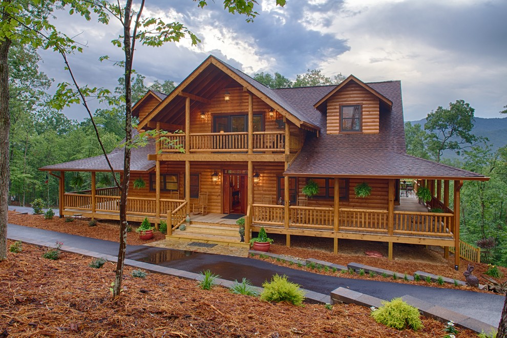 Inspiration for a rustic two floor house exterior in Atlanta with wood cladding.
