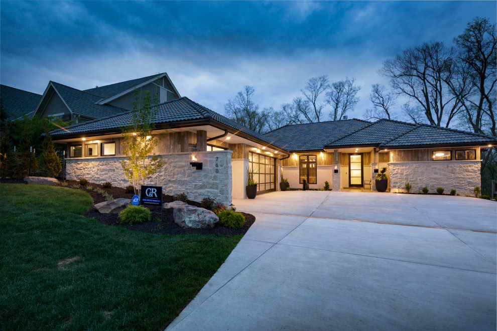 Inspiration for a beige modern bungalow detached house in Kansas City with stone cladding, a hip roof and a tiled roof.