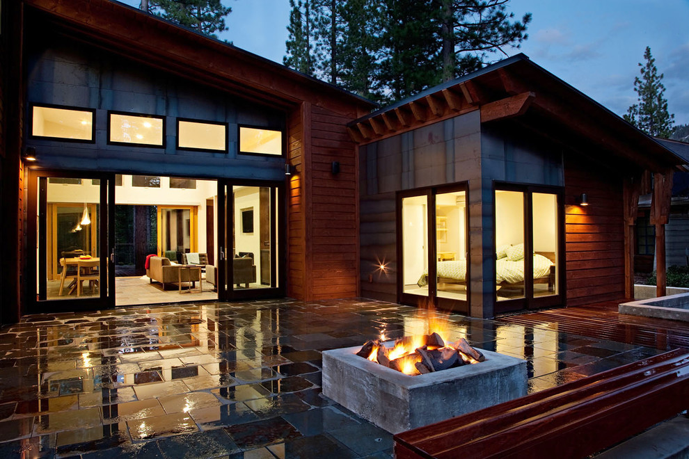 Inspiration for a contemporary house exterior in Sacramento with wood cladding.