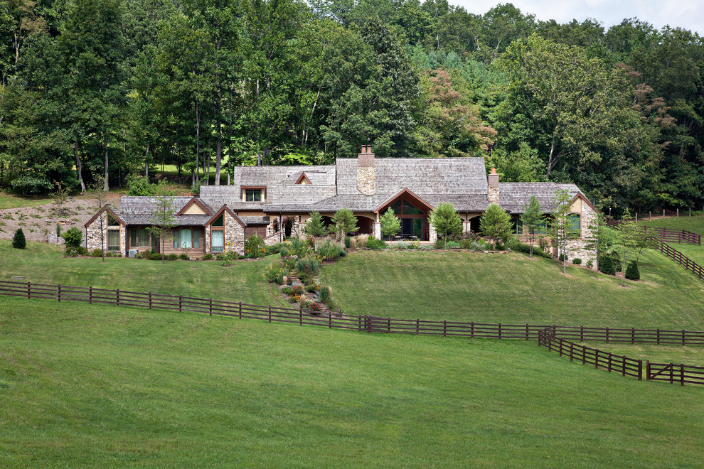 This is an example of a large rural two floor house exterior in Other.