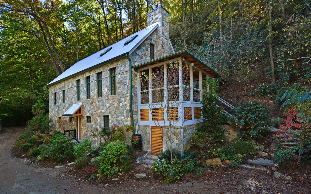 Mid-sized mountain style gray two-story stone exterior home photo in Boston