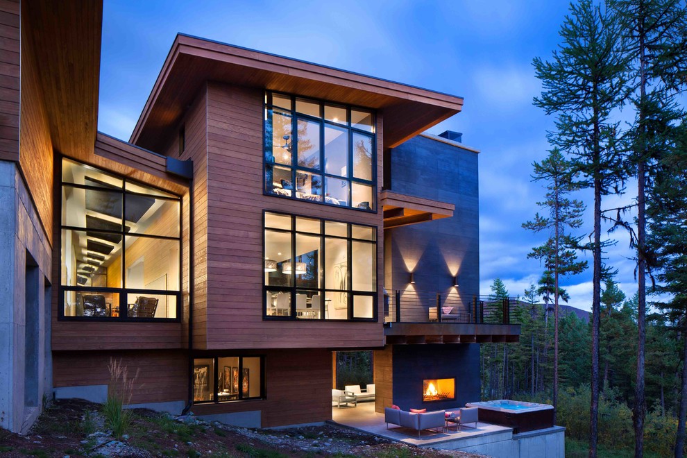 Источник вдохновения для домашнего уюта: огромный, двухэтажный, стеклянный, коричневый дом в стиле модернизм
