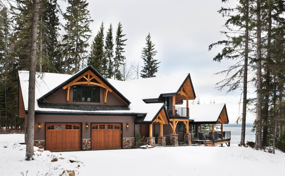 Example of a mountain style brown three-story mixed siding exterior home design in Edmonton