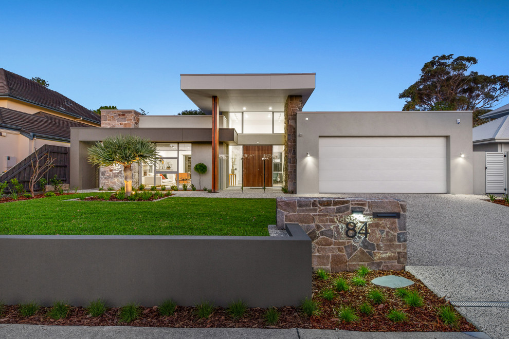 Mittelgroßes, Zweistöckiges Modernes Einfamilienhaus mit Mix-Fassade, grauer Fassadenfarbe und Flachdach in Perth