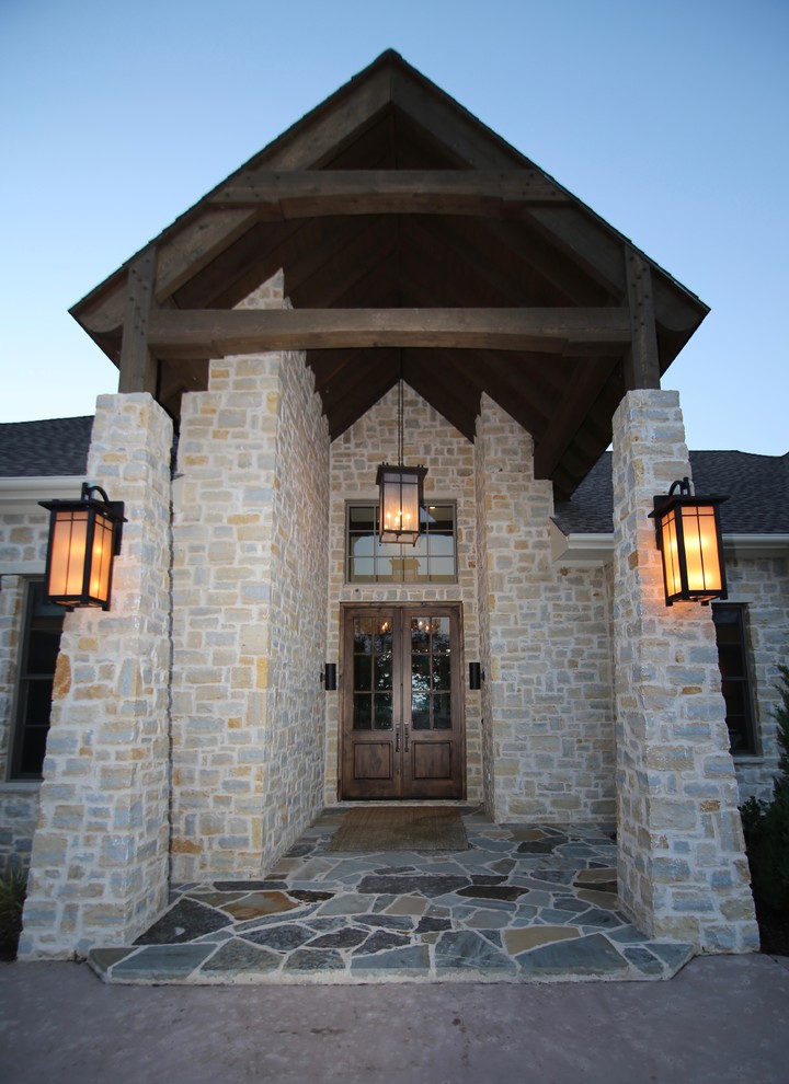 Mid-sized elegant gray one-story stone house exterior photo in Dallas with a hip roof and a shingle roof