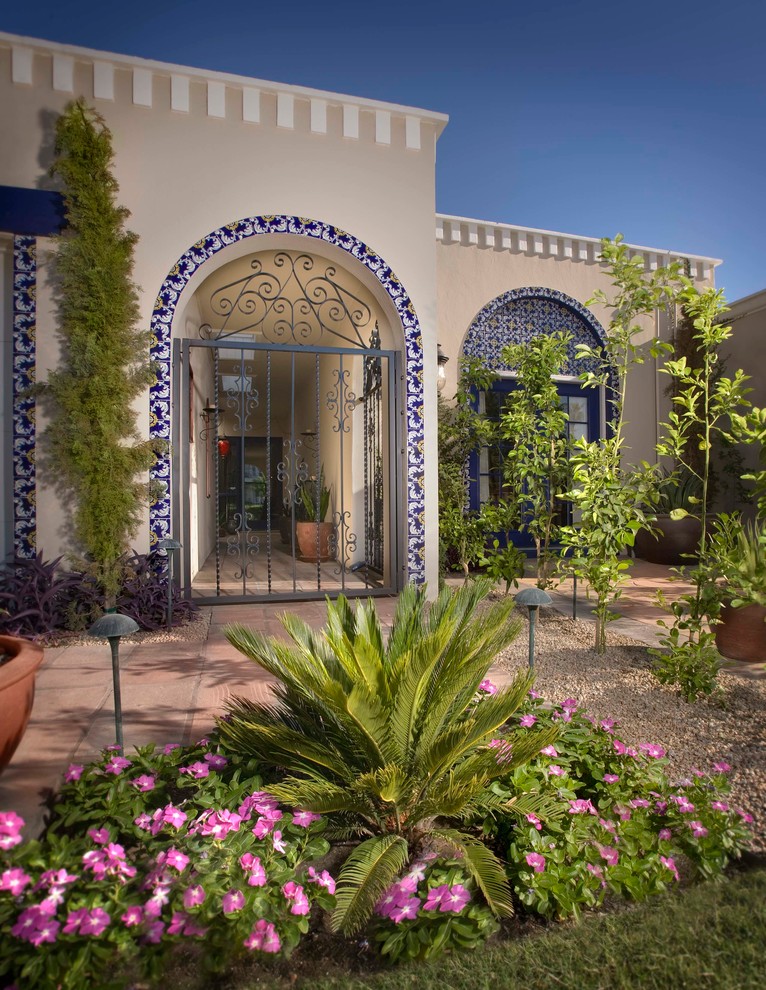 Design ideas for a mediterranean house exterior in Phoenix.