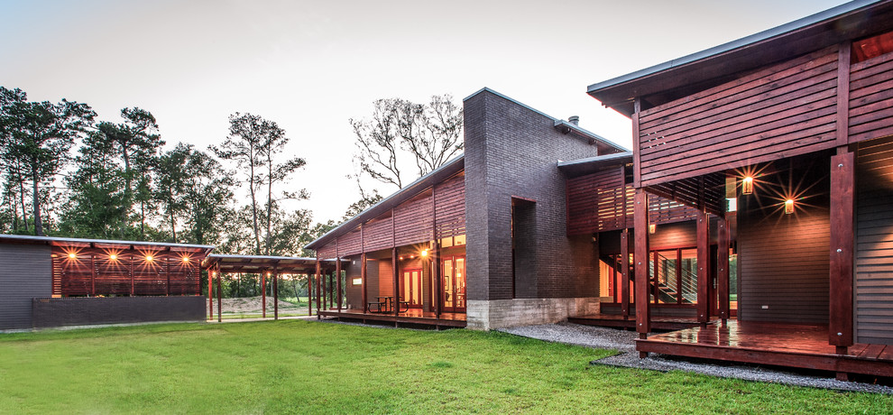 Contemporary wood exterior home idea in Other