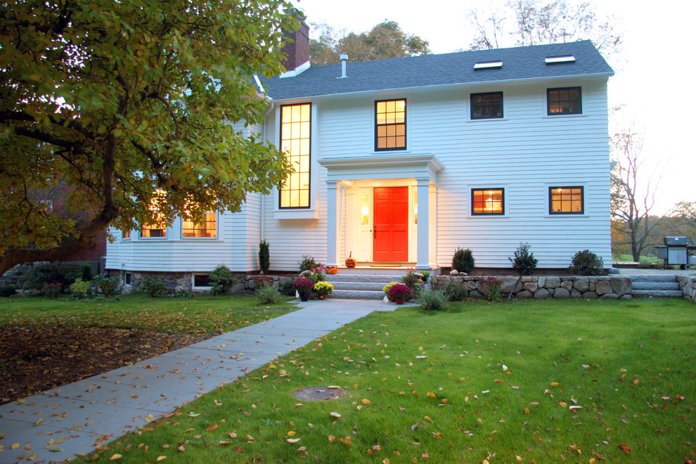 Photo of a classic house exterior in Denver with wood cladding.