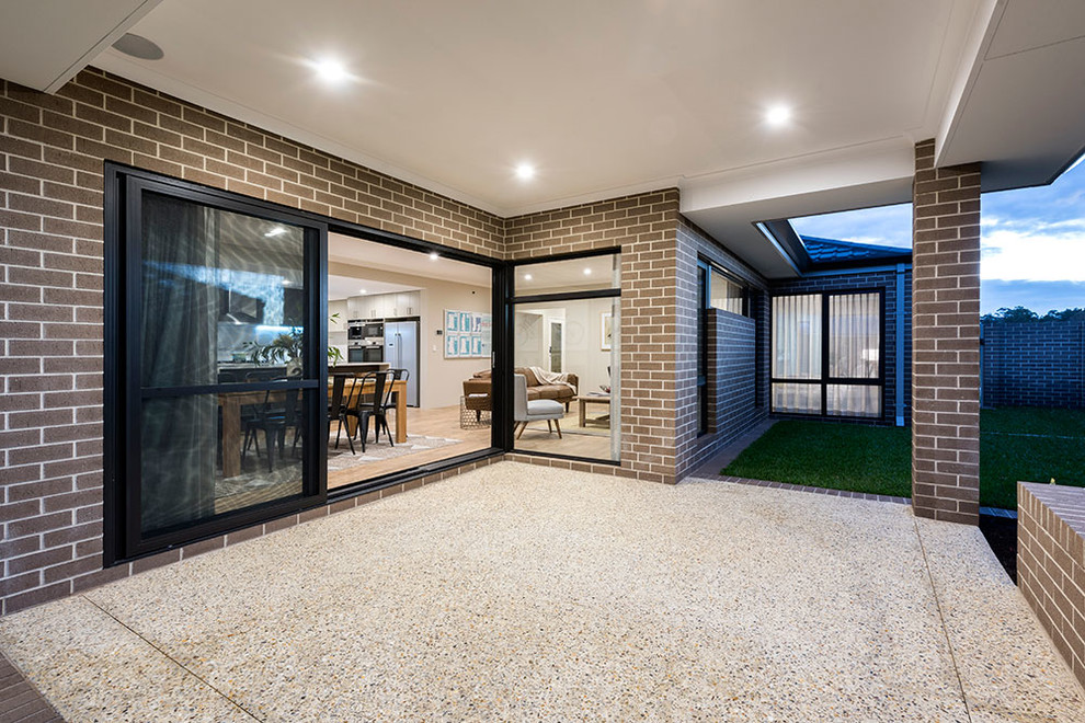 Trendy beige one-story brick exterior home photo in Perth