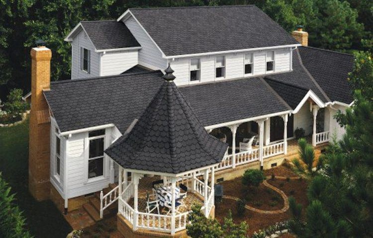 Mid-sized traditional white two-story wood exterior home idea in Omaha with a shingle roof