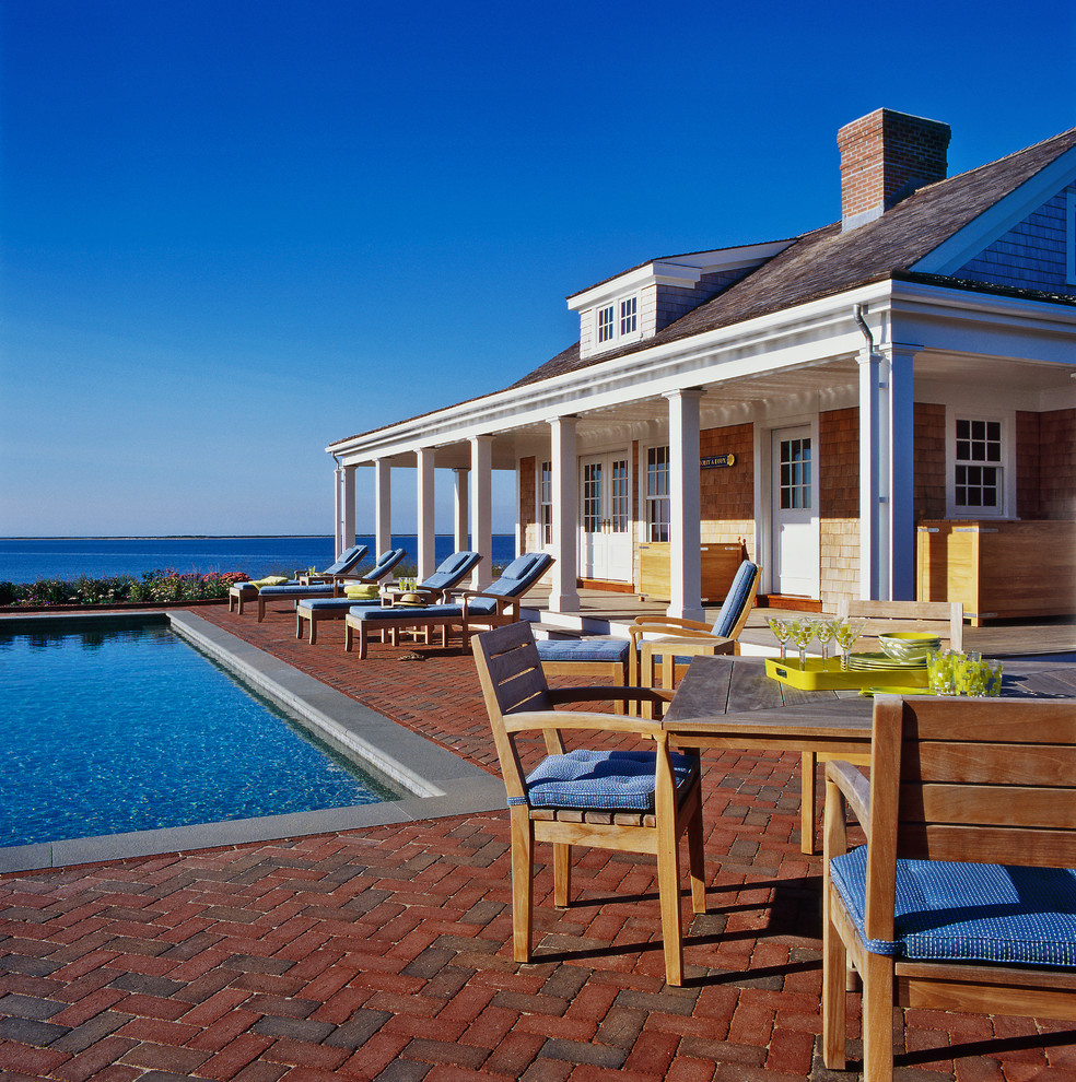 Large beach style multicolored two-story wood and shingle house exterior photo in Boston with a gambrel roof, a shingle roof and a gray roof