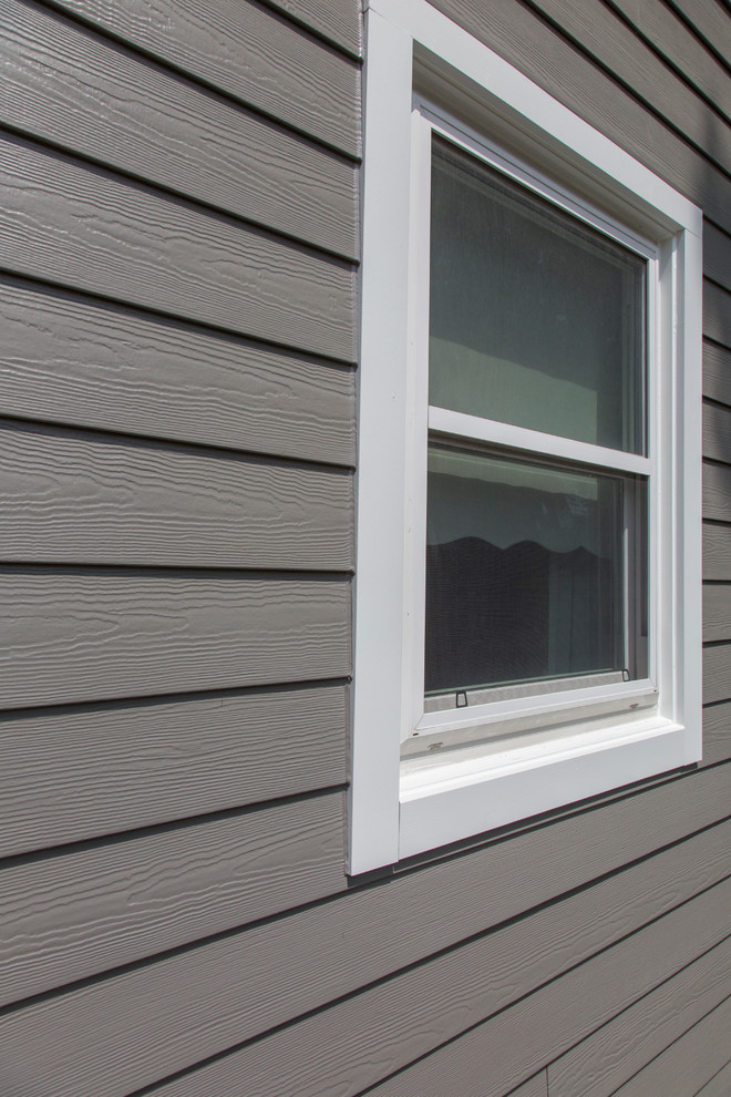 Naperville home with renovated exterior and gambrel roof. Traditional