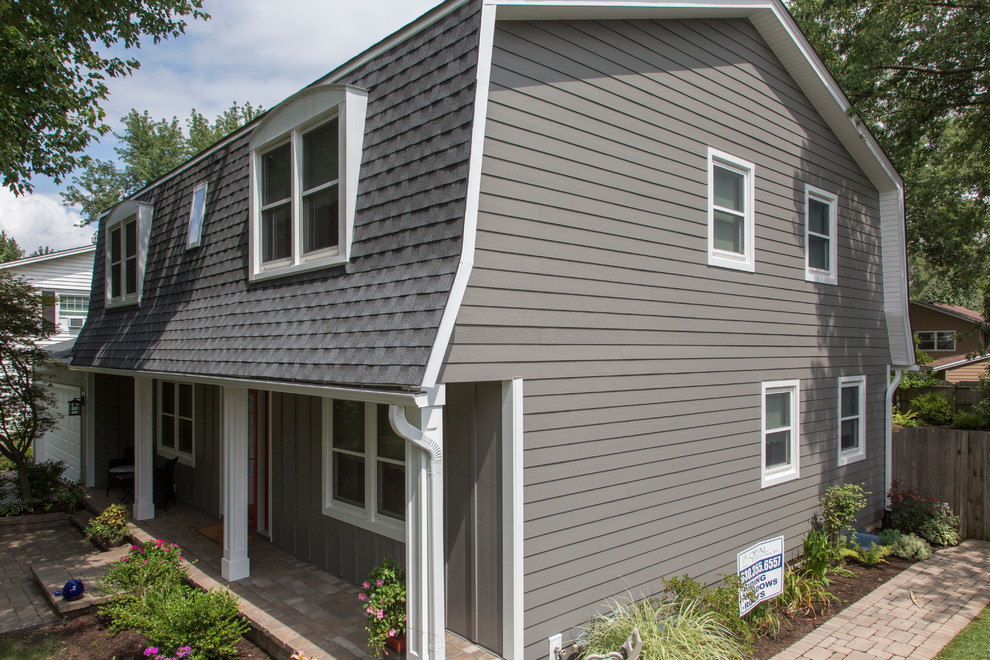 Naperville home with renovated exterior and gambrel roof. Traditional