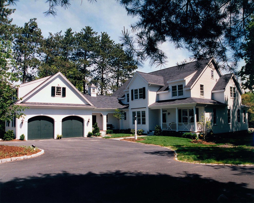 Inspiration for a mid-sized timeless white two-story wood exterior home remodel in Boston with a shingle roof