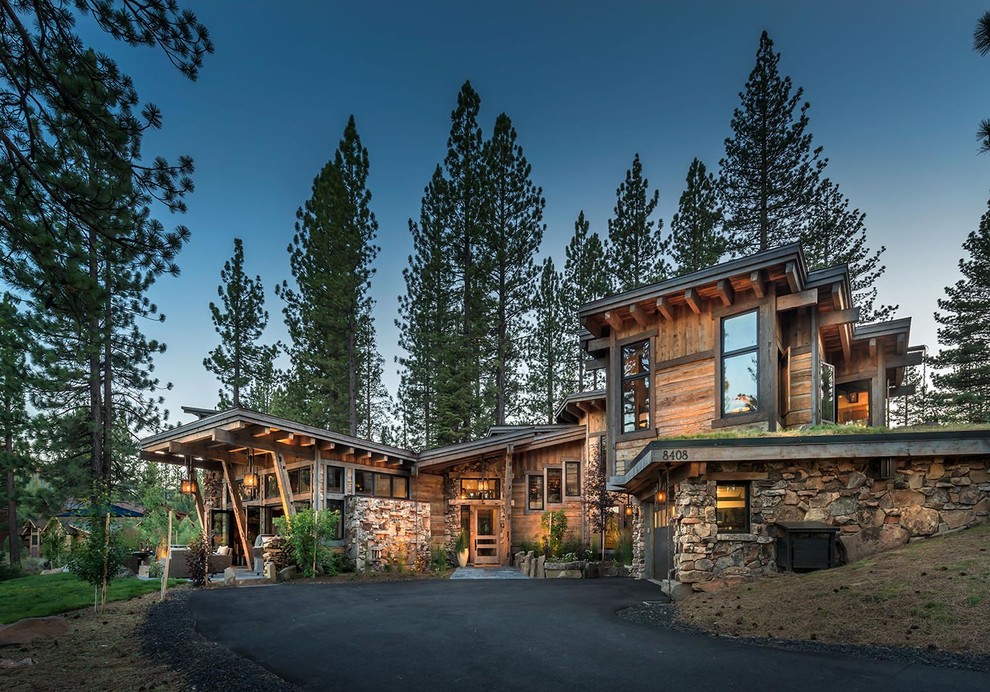 Rustic house exterior in Sacramento with wood cladding and a lean-to roof.
