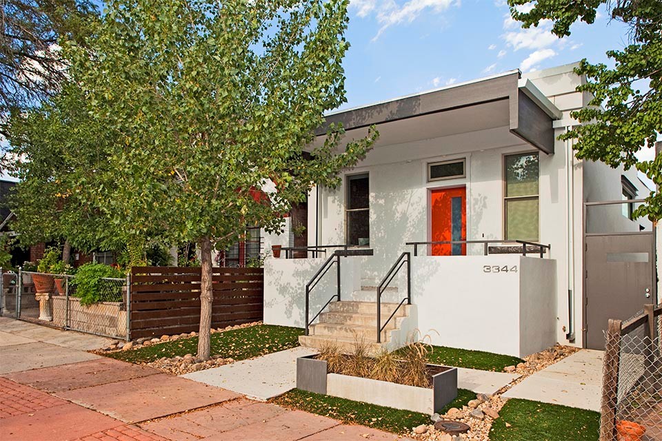 Mid-sized eclectic white one-story stucco exterior home photo in Denver