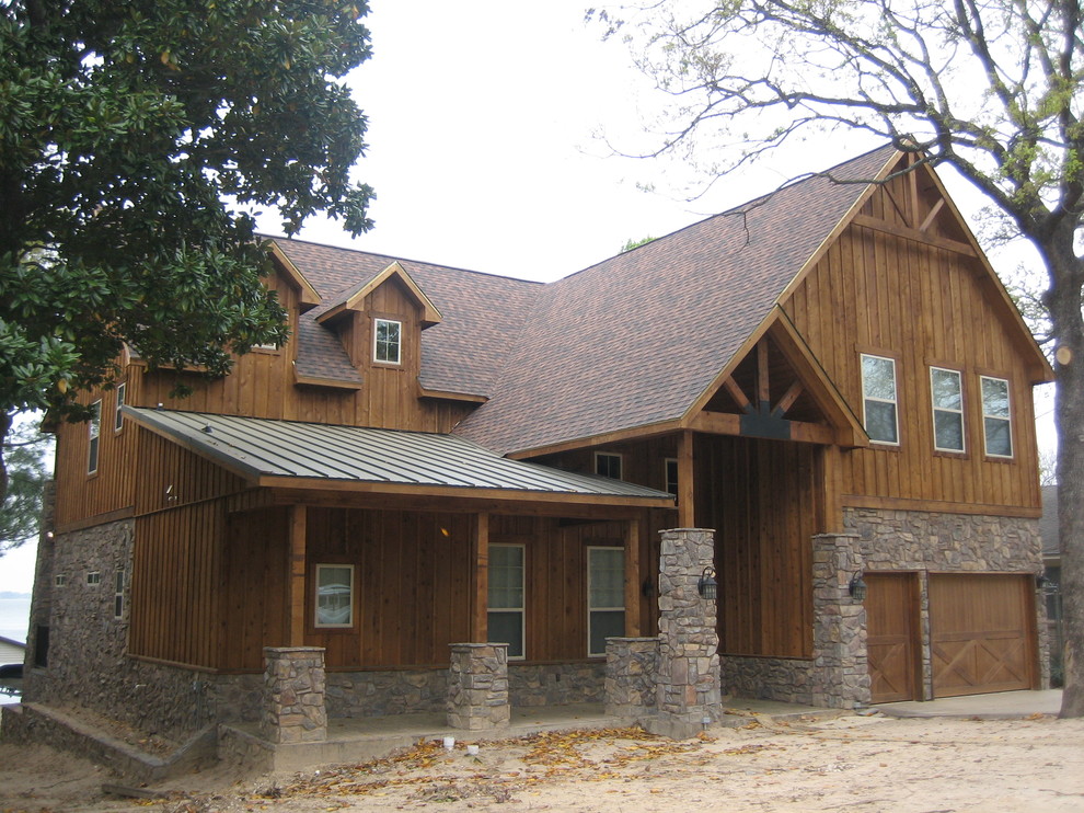 Inspiration for a large rustic multicolored two-story mixed siding gable roof remodel in Dallas