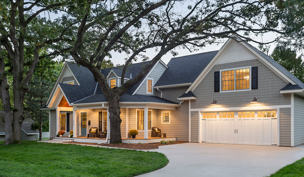 Design ideas for a gey traditional two floor house exterior in Minneapolis with concrete fibreboard cladding and a pitched roof.