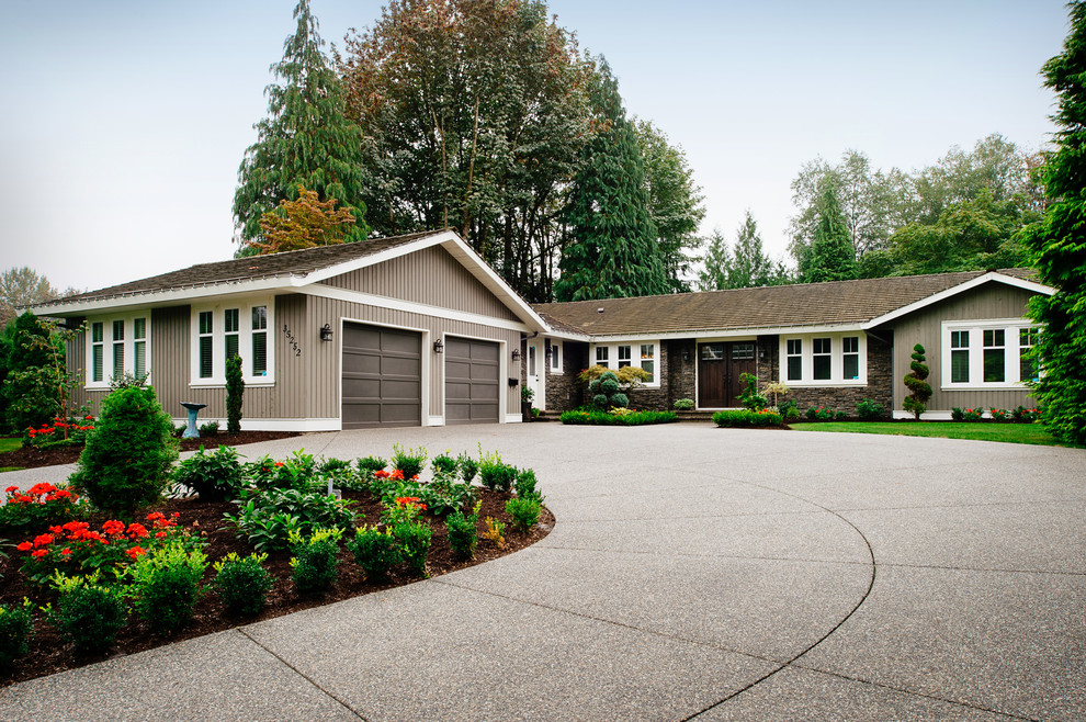 Transitional stone exterior home idea in Vancouver
