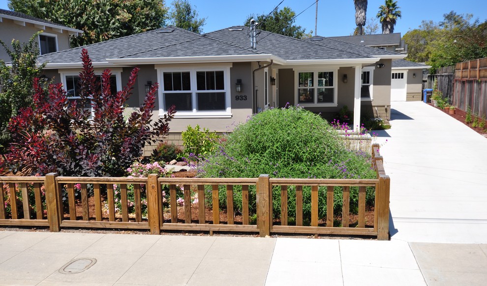 This is an example of a medium sized and gey classic bungalow concrete house exterior in San Francisco.