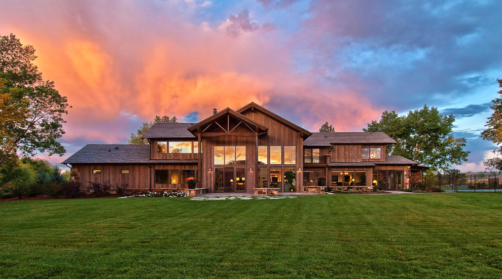 This is an example of a contemporary house exterior in Denver with wood cladding.