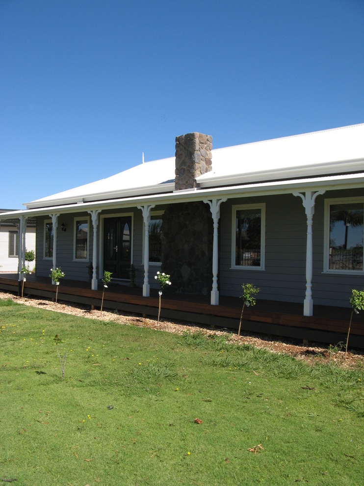 This is an example of a large and gey country bungalow house exterior in Melbourne with concrete fibreboard cladding.