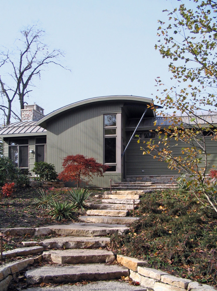 Design ideas for a contemporary house exterior in Chicago with stone cladding.