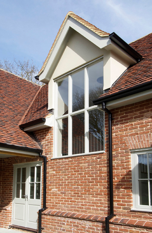Photo of a contemporary two floor brick house exterior in Essex.