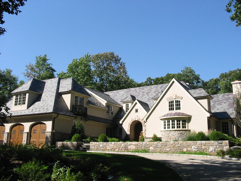 Photo of a medium sized and beige traditional two floor detached house in New York with mixed cladding, a pitched roof and a shingle roof.