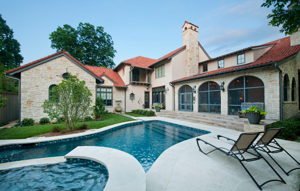 Photo of a mediterranean house exterior in Dallas with stone cladding.