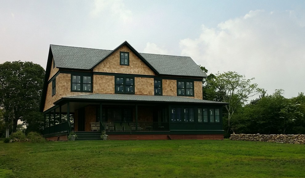 Inspiration for a large craftsman beige two-story wood gable roof remodel in Providence