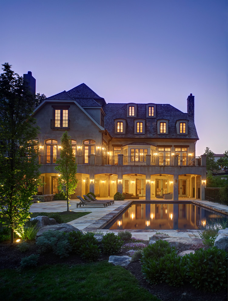 Tuscan brown three-story stucco exterior home photo in DC Metro