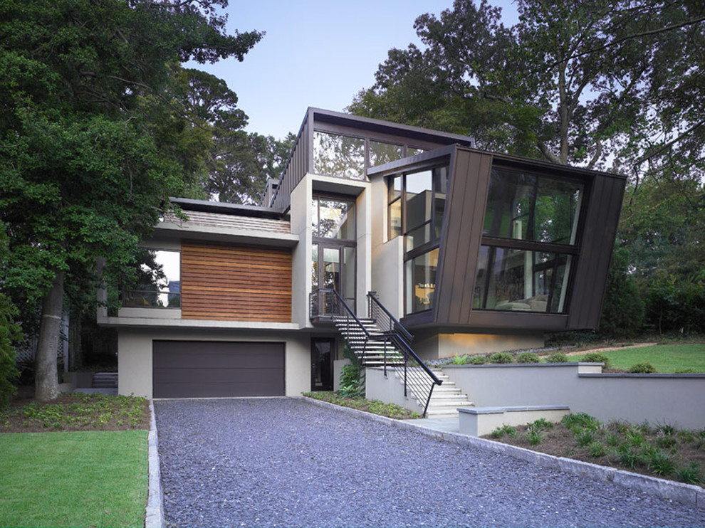 Inspiration för ett stort funkis flerfärgat hus, med metallfasad, tre eller fler plan, platt tak och tak i metall