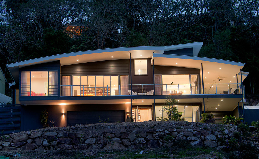 Example of a huge trendy blue two-story metal exterior home design in Brisbane