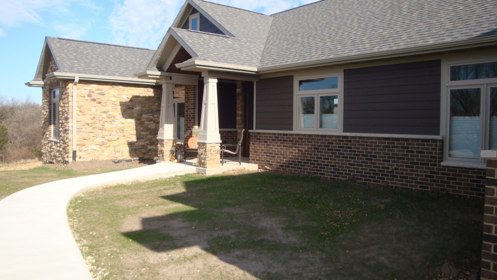 Medium sized classic bungalow brick house exterior in Cedar Rapids.